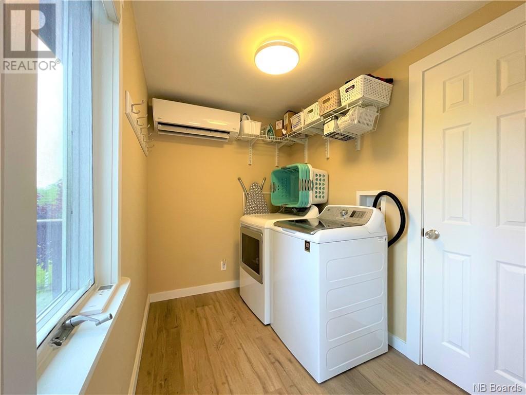 Laundry room with mini split and painted walls