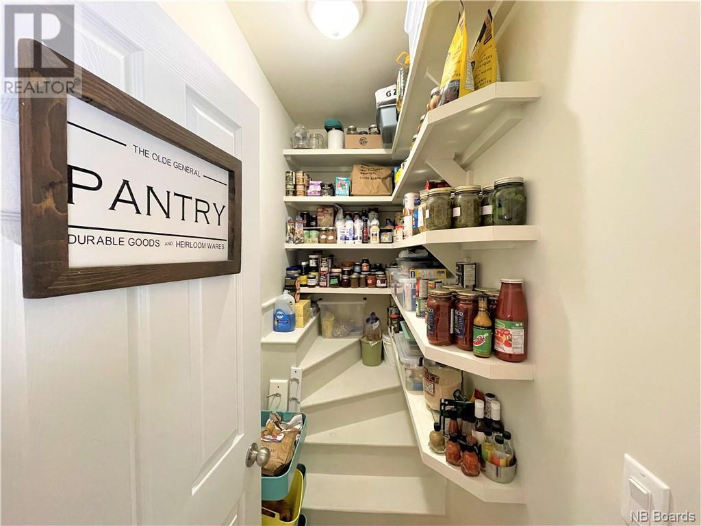 Organized pantry under staircase