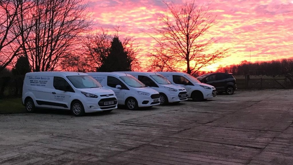 The modern fleet — 28 vans on the road, covering Oxfordshire and beyond.