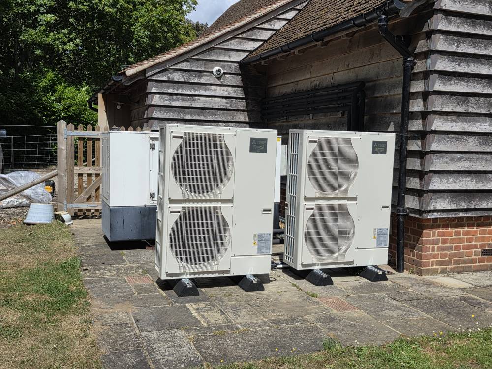 Twin Mitsubishi ZUBADAN Heat Pumps — Patio Installation — Renewables project by Curtis and Carder