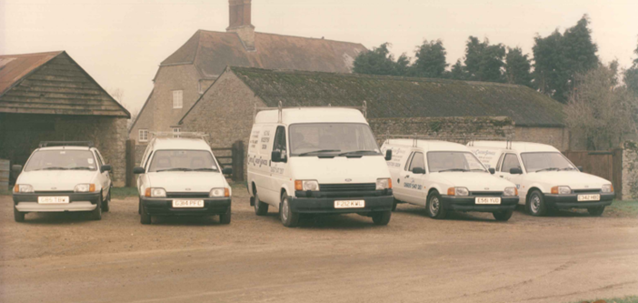 The original Curtis and Carder fleet of vans lined up at the yard