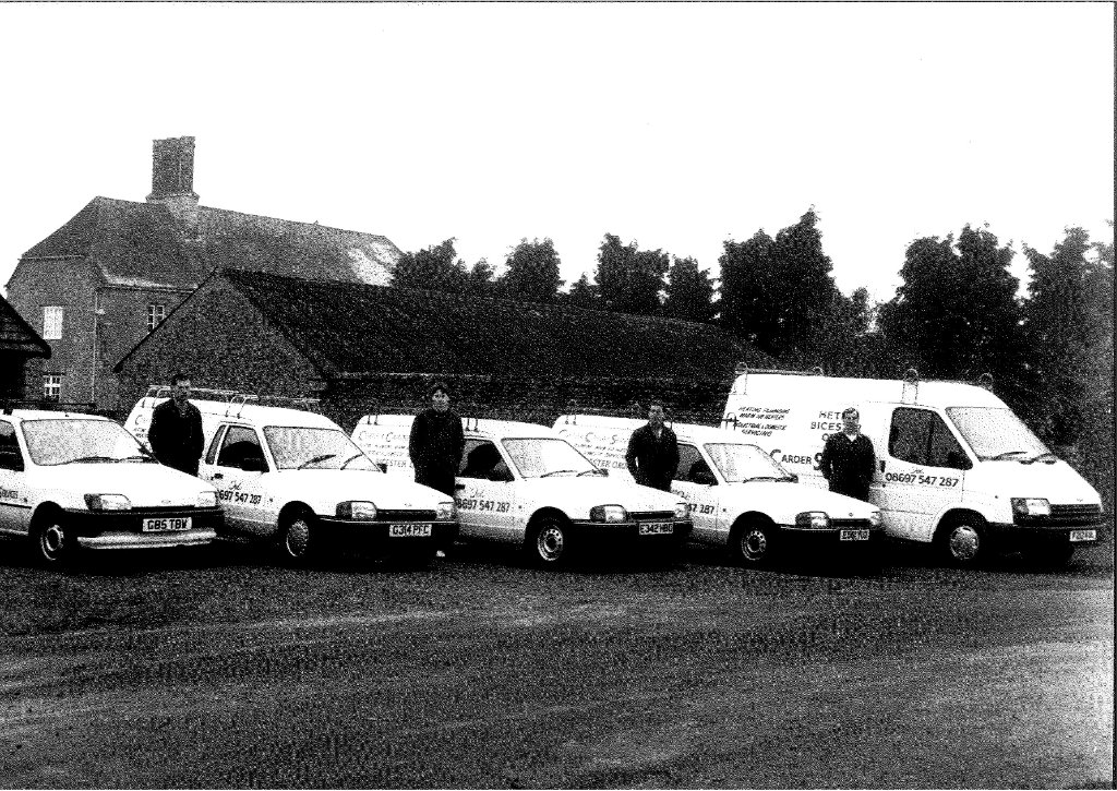 The original fleet and crew — a handful of vans and a lot of hard work.