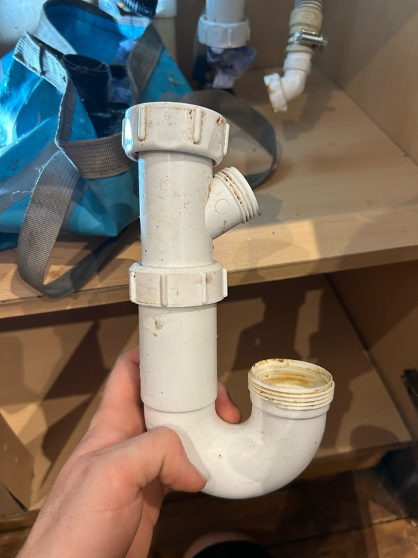 Under-Sink Water Leak — Before — Plumbing project by Curtis and Carder