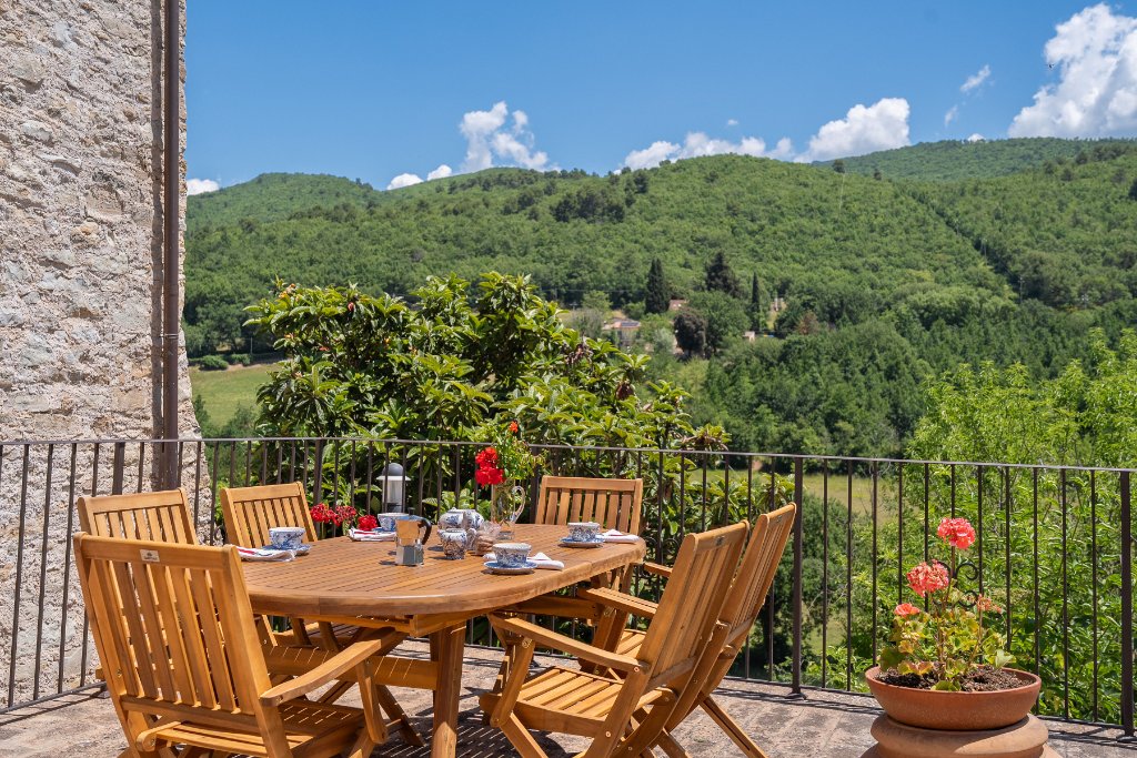 Terrace with dining table and mountain views