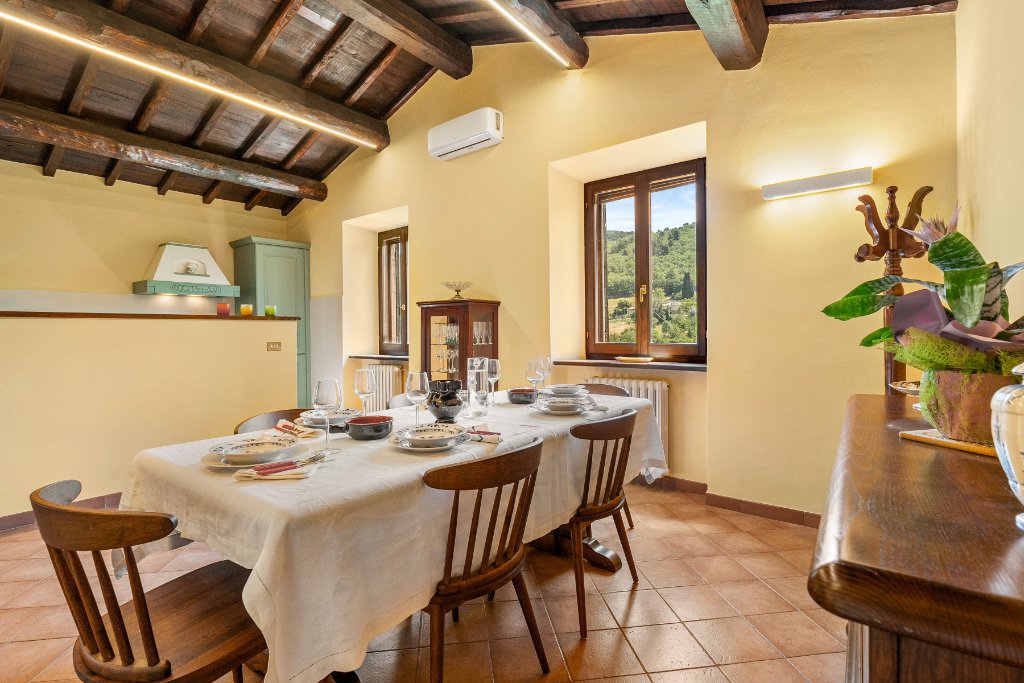Dining room set for dinner with window view