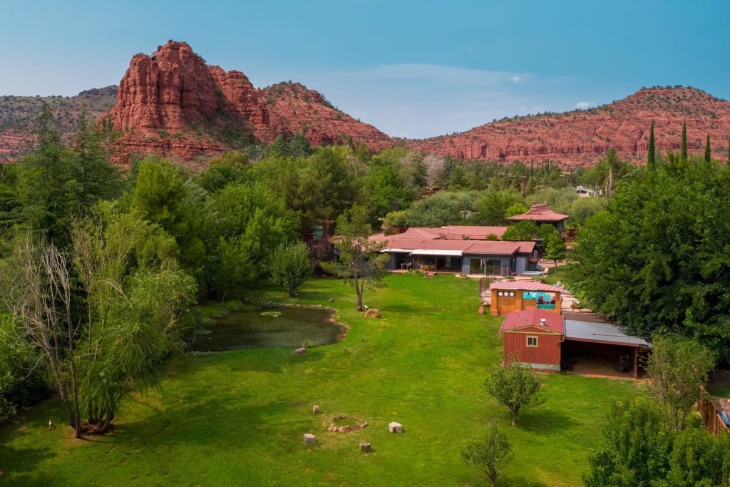 Aerial view of the 1.7 acre Sedona retreat property framed by red rock mesas
