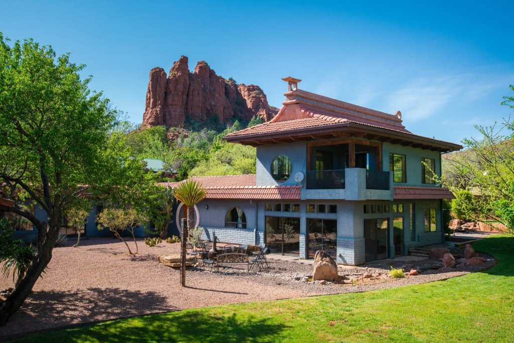 The retreat house set against Sedona's towering red rock spires