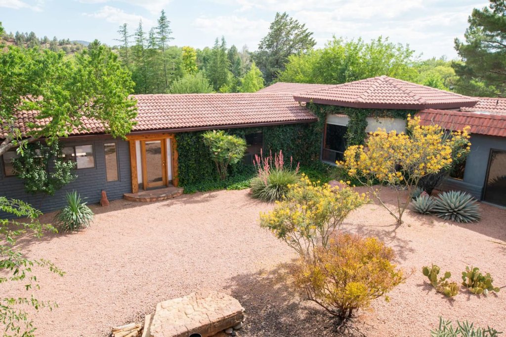 High-angle view of the retreat house courtyard with desert landscaping and native flora