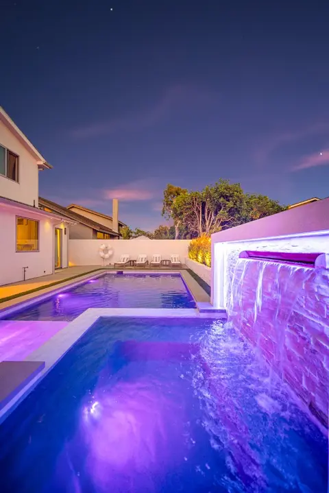 Pool deck and fire pit at a completed Huntington Beach residence
