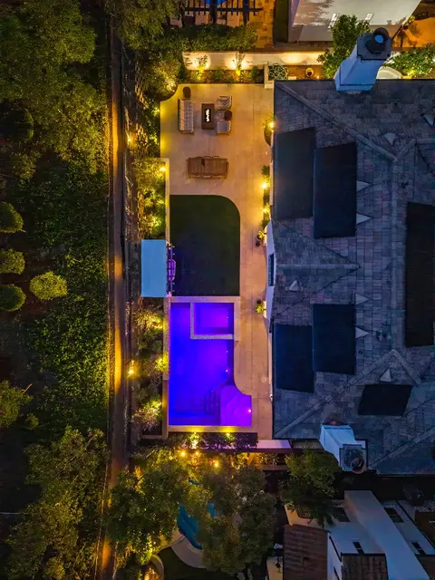 Sheer-descent spillway on a modern geometric pool in Tustin, California
