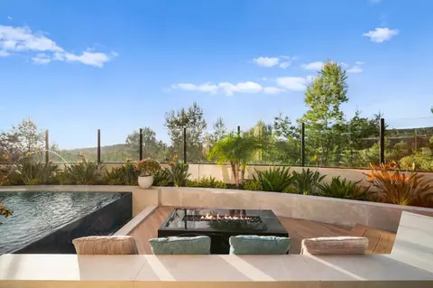 Modern hardscape decking around a custom pool in Irvine, California