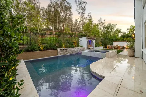 Custom gunite pool detail with travertine coping in Tustin, California