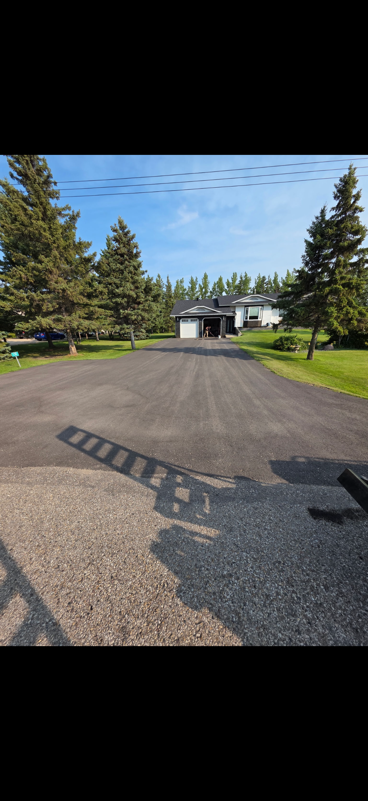 Asphalt driveway before slurry seal application