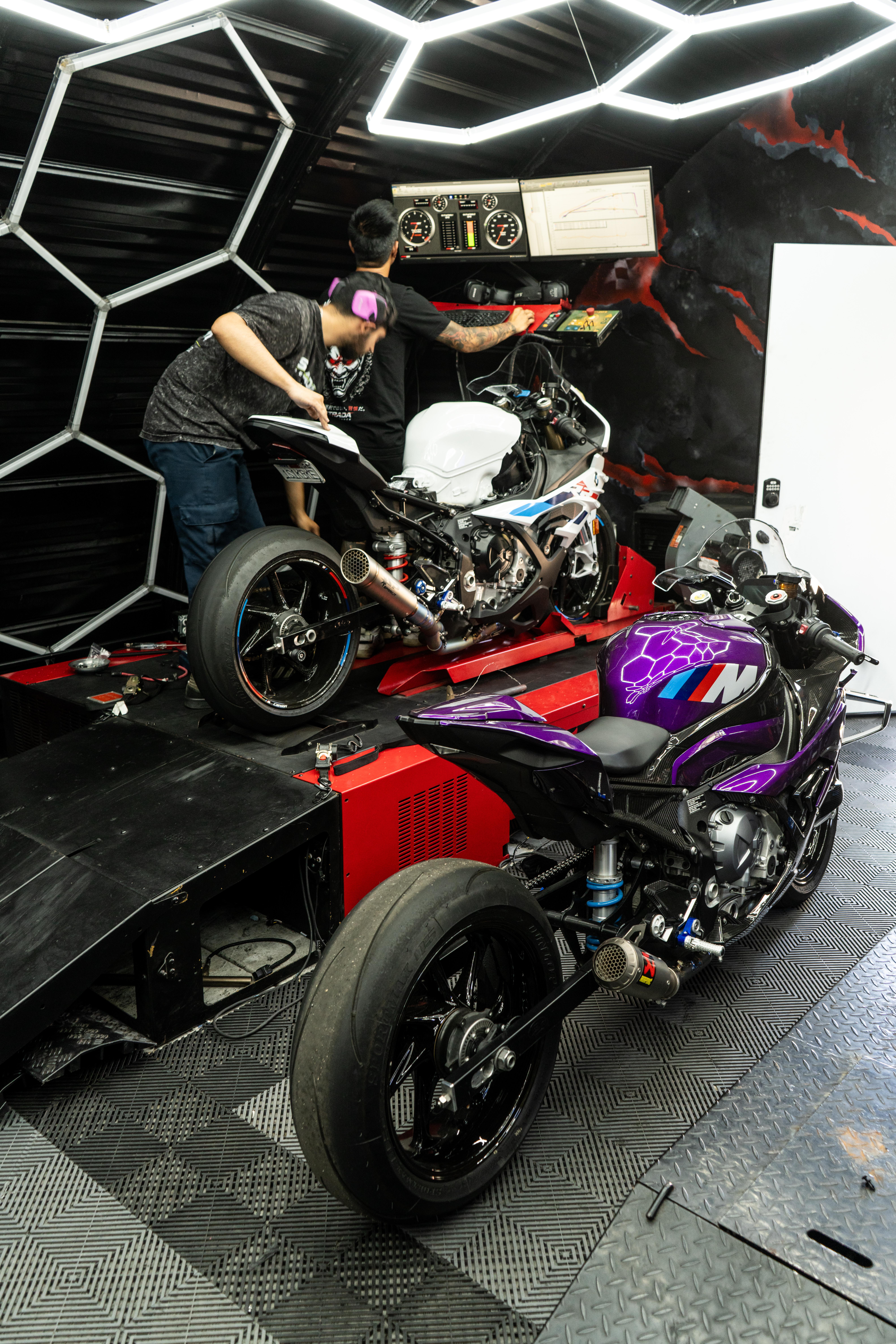 Technician working on motorcycle