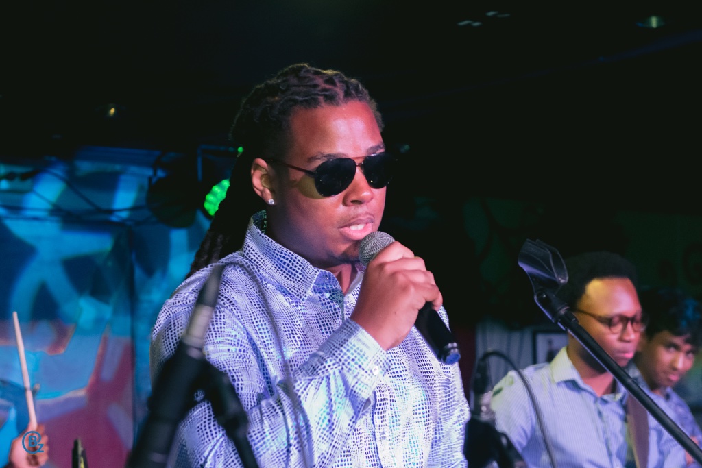 Kobie Alleyne performing on stage