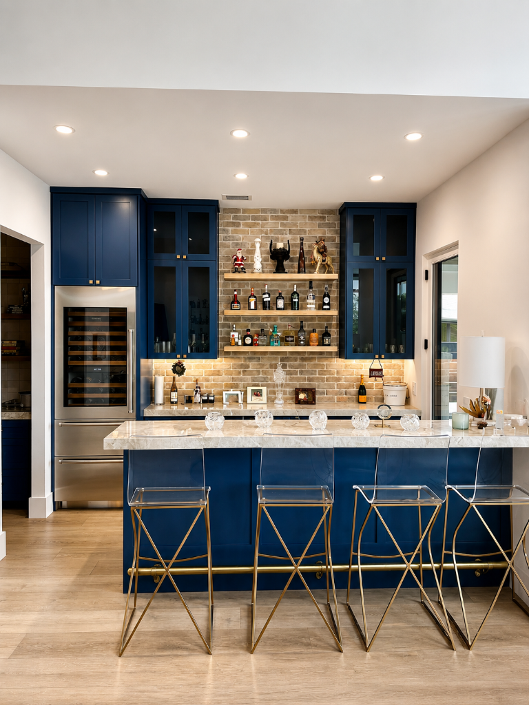 Navy cabinetry with brick backsplash, floating wood shelves, and acrylic bar stools