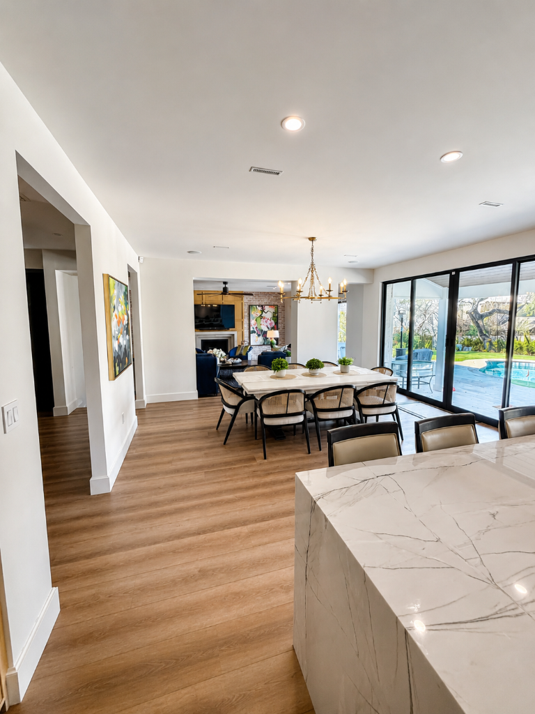 Dated honey-oak kitchen and dining area opened up into a bright, modern living space