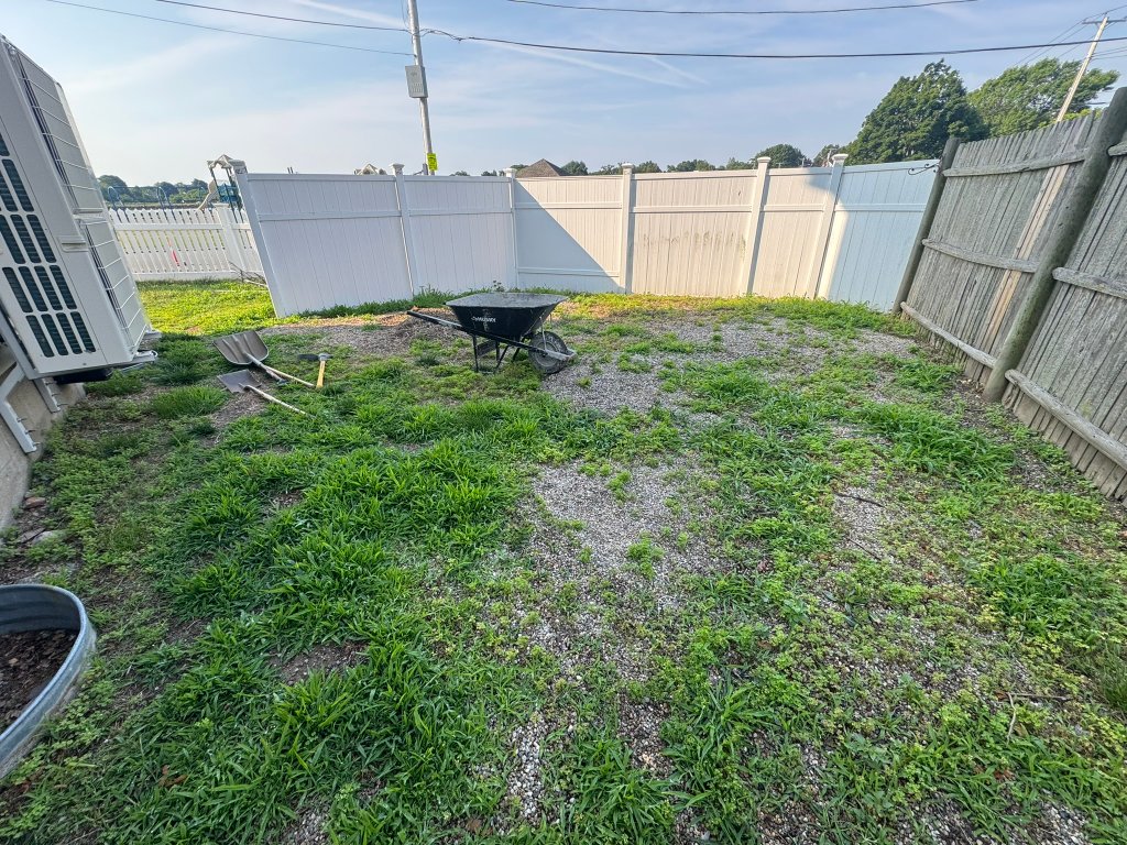 Project staging area with tools and wheelbarrow before construction