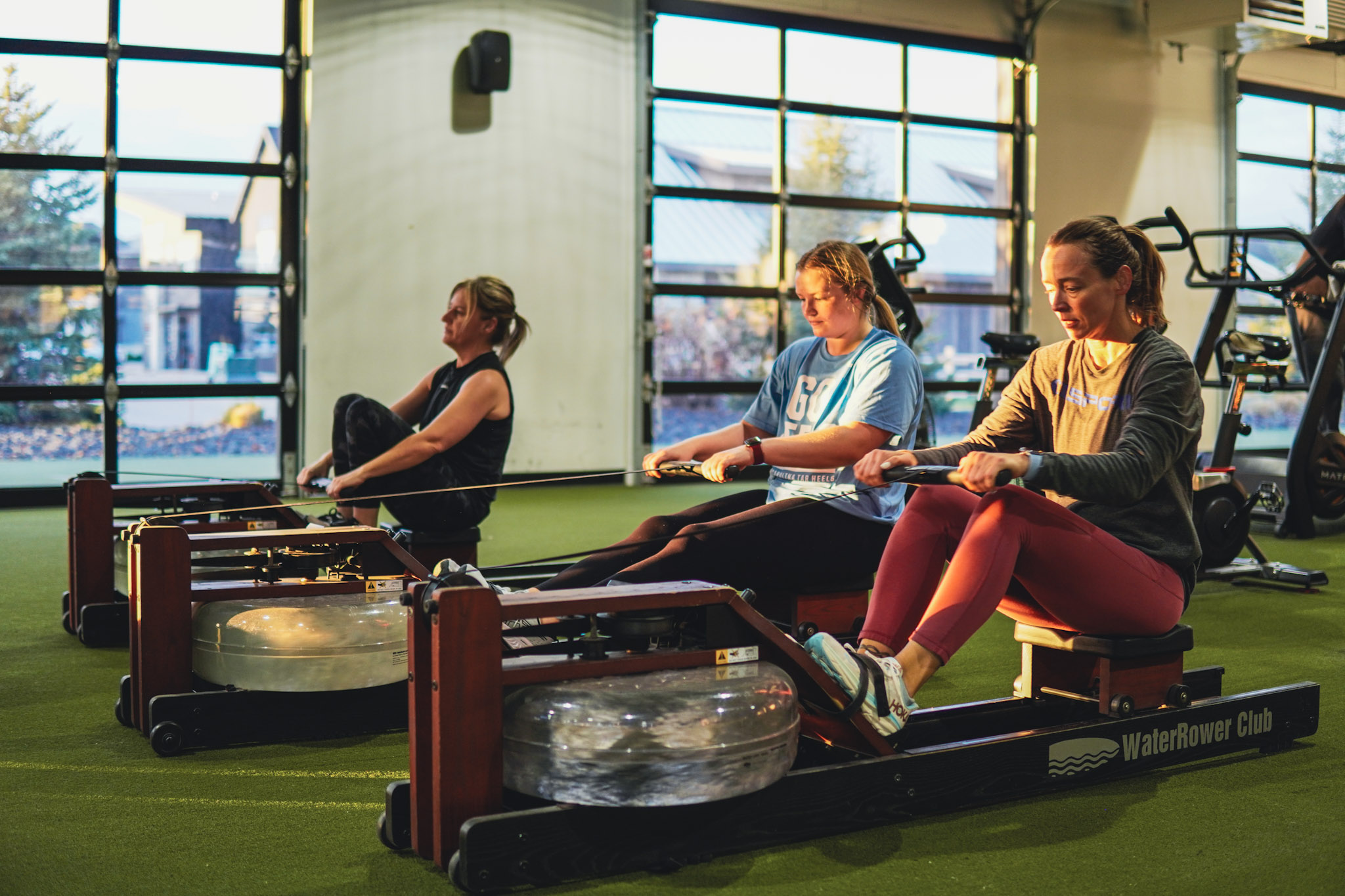 Women training on WaterRower machines during a MELT Challenge at Maximum Performance & Fitness in West Fargo, ND