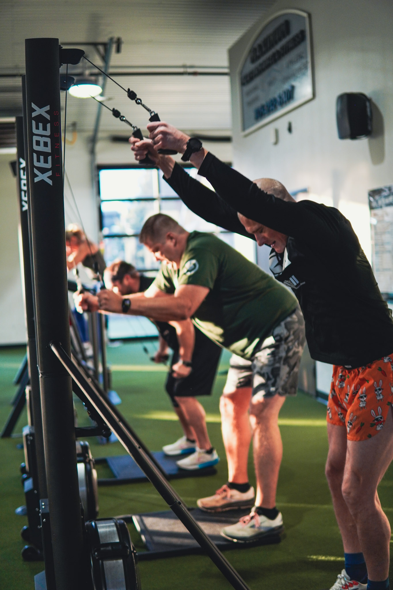 Members rowing on WaterRower machines during a MELT Challenge fat loss competition at Maximum Performance & Fitness in West Fargo, ND
