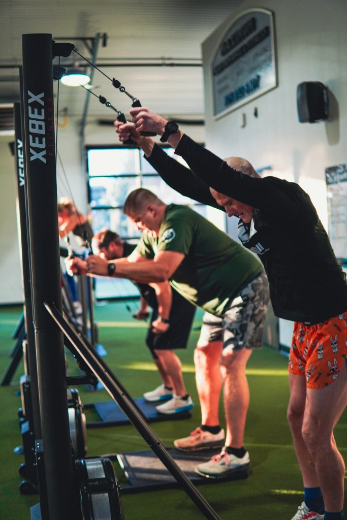 MPF members training on cable machines