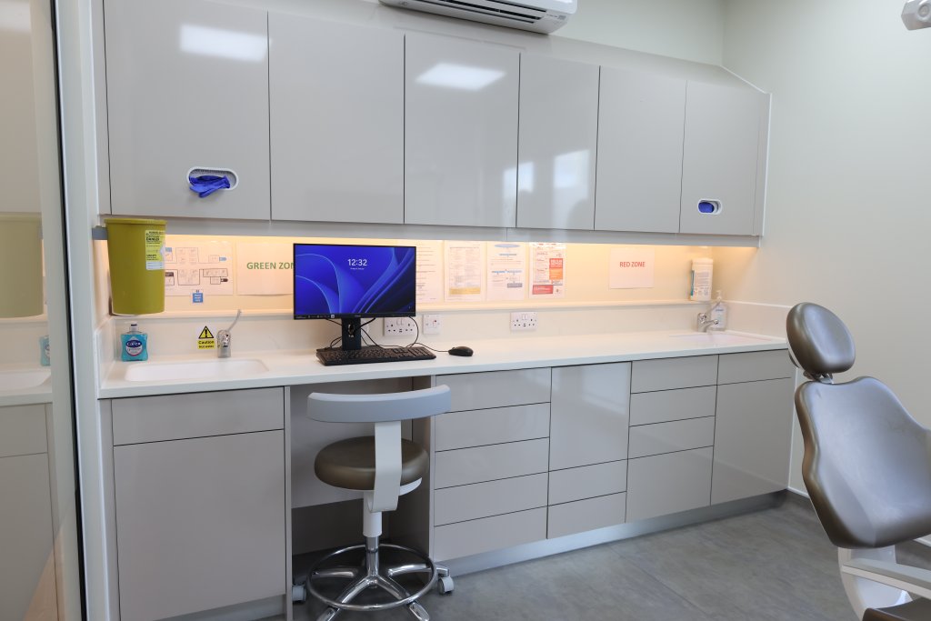 Dental treatment room with cabinetry