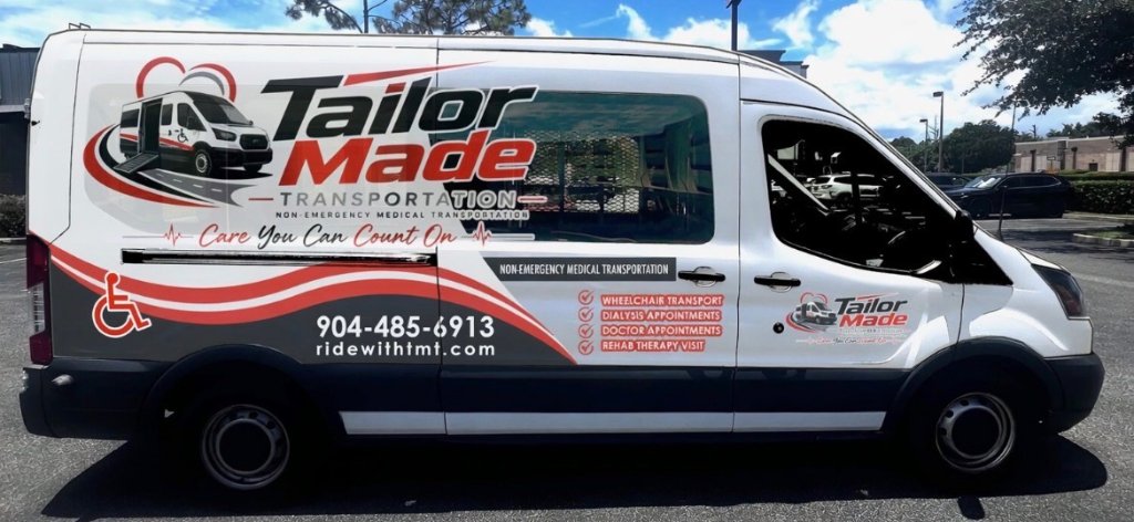 Rear view of TailorMade Transportation van featuring wheelchair accessibility ramp and safety equipment