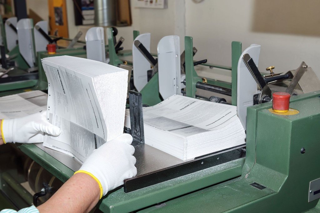 Lamination House technician servicing office equipment