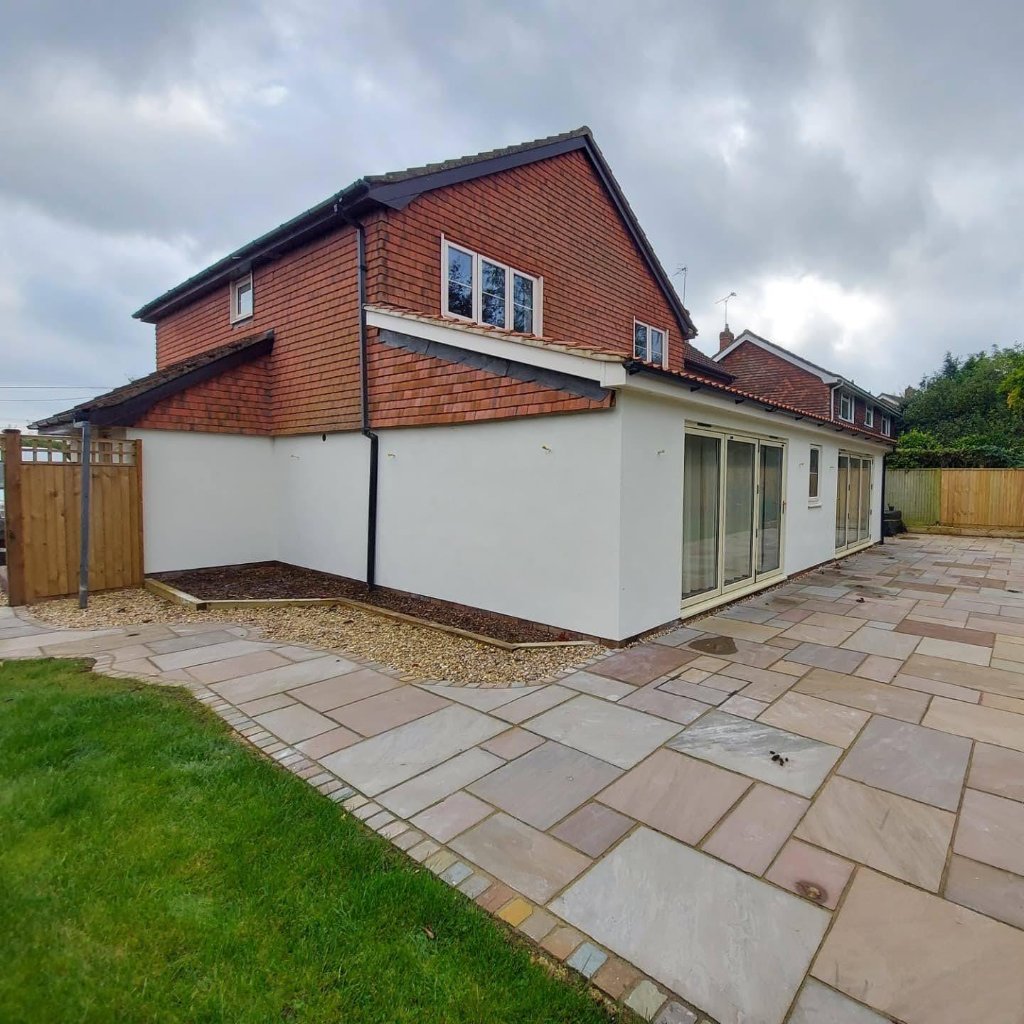 Wide shot — extension render with patio and lawn