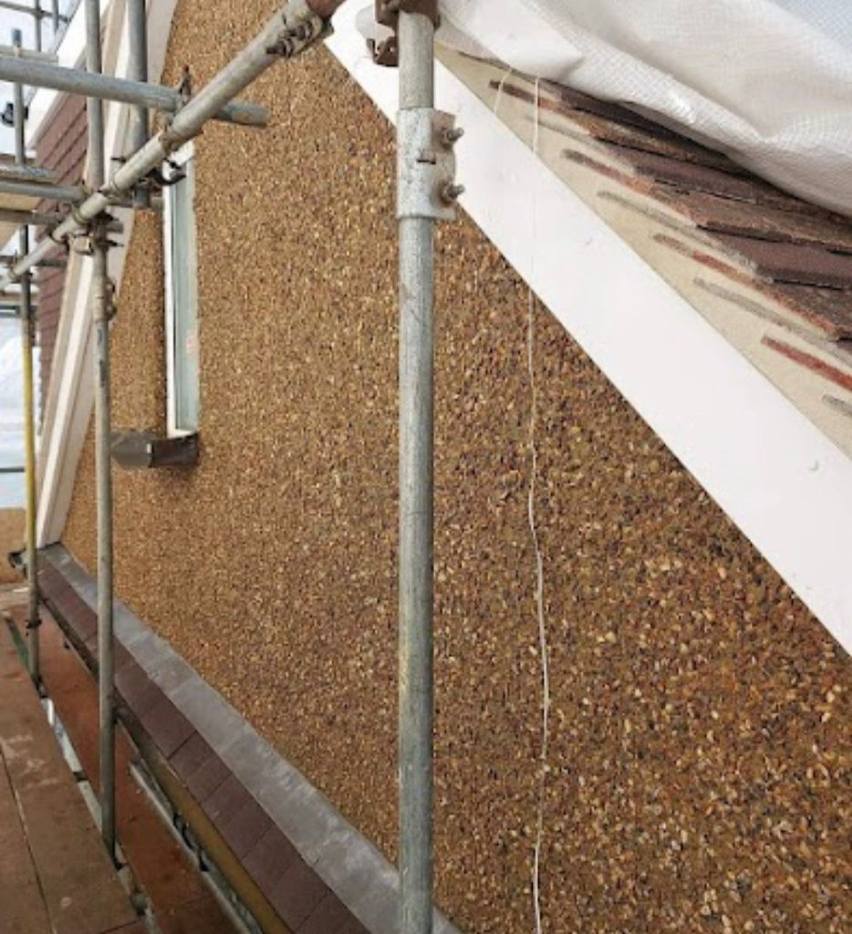 Gable end pebble dash finish with scaffold access during application