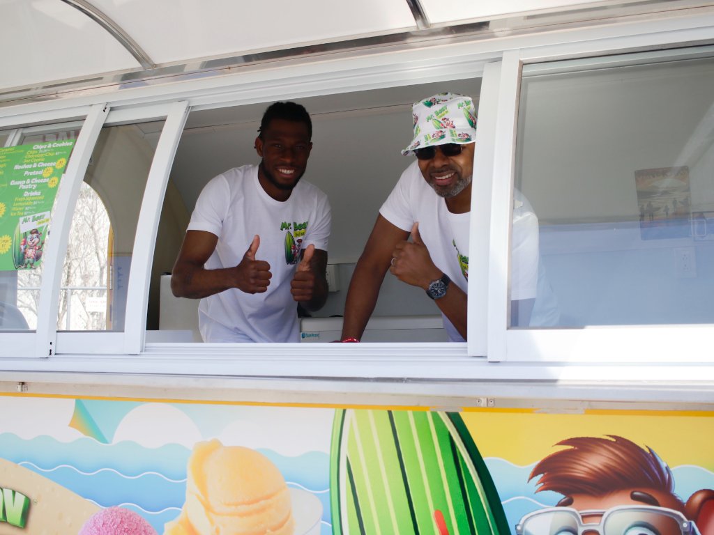 Dave and Terrell behind the Mr. Beav food trailer service window
