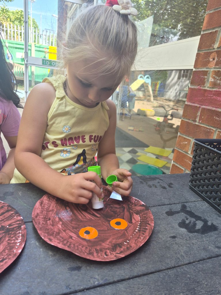 Child crafting a Gruffalo mask at Morning Glory Pre-School
