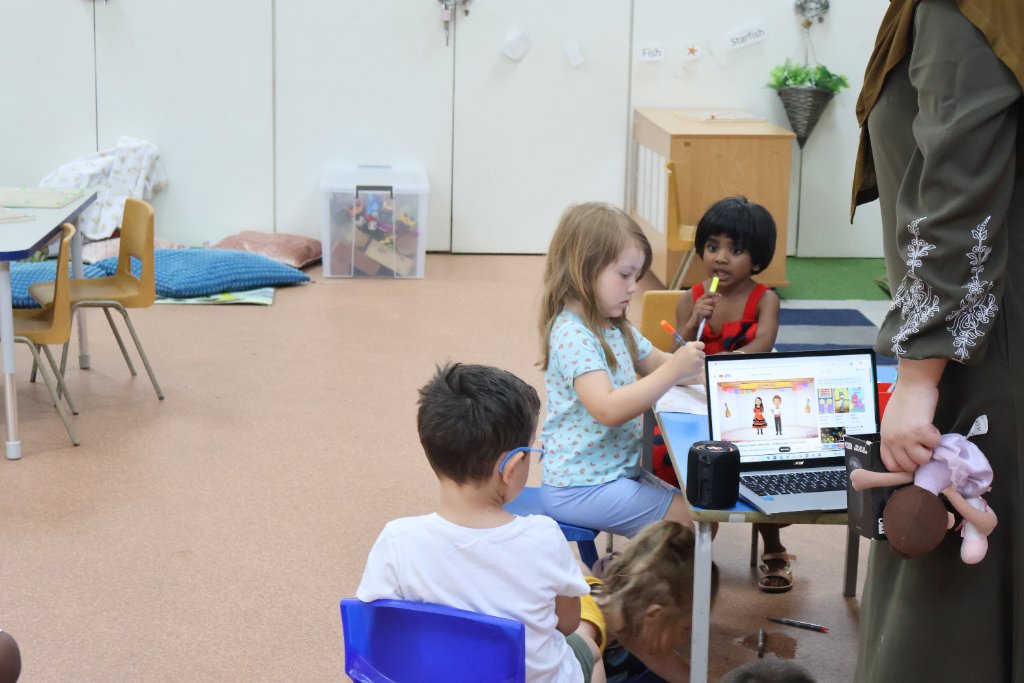 Children learning together at a table at Morning Glory Pre-School