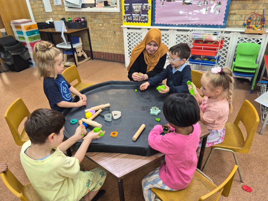 Children playing with green playdough at Morning Glory Pre-School