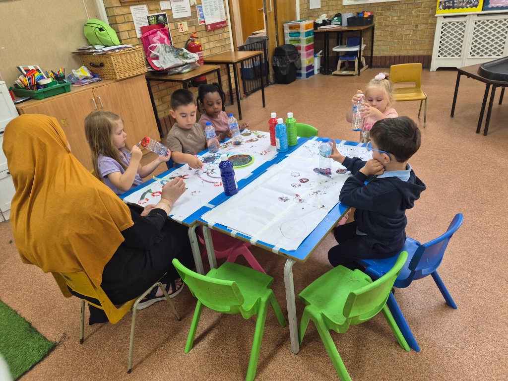 Children creating bottle-stamp art at Morning Glory Pre-School