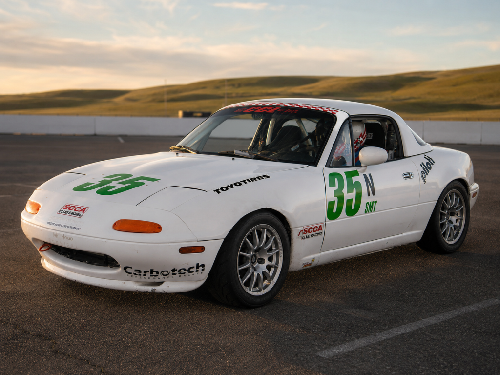 A+ Racing Spec Miata in the paddock at golden hour