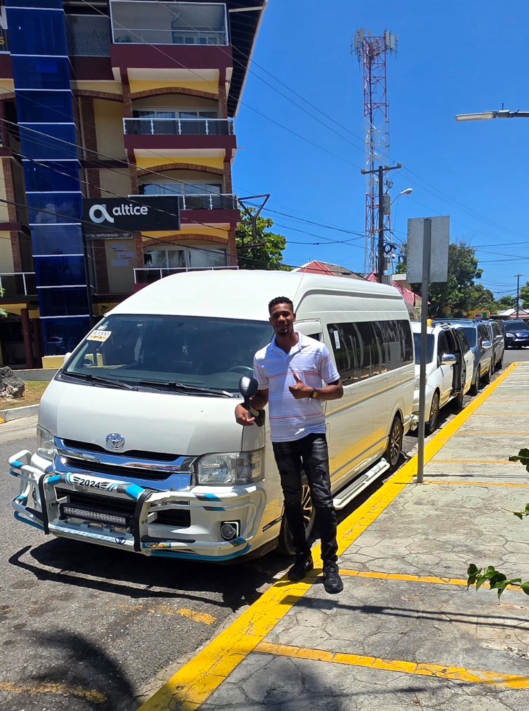 Joel, owner of Williams Service Taxi & Tours, with his Toyota Hiace in Puerto Plata