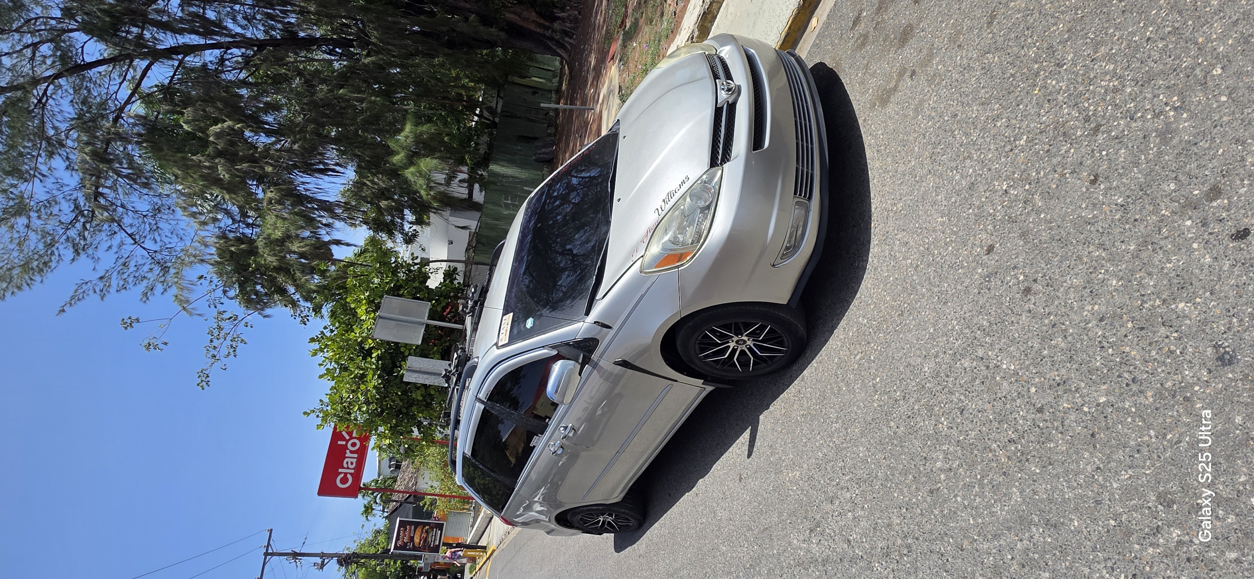 Private airport transfer service in the Dominican Republic by Williams Service Taxi & Tours featuring a silver Toyota passenger van.