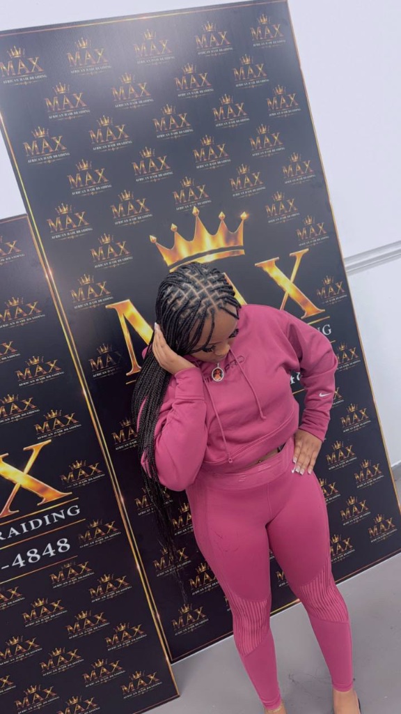 Client with cornrow braids in pink outfit