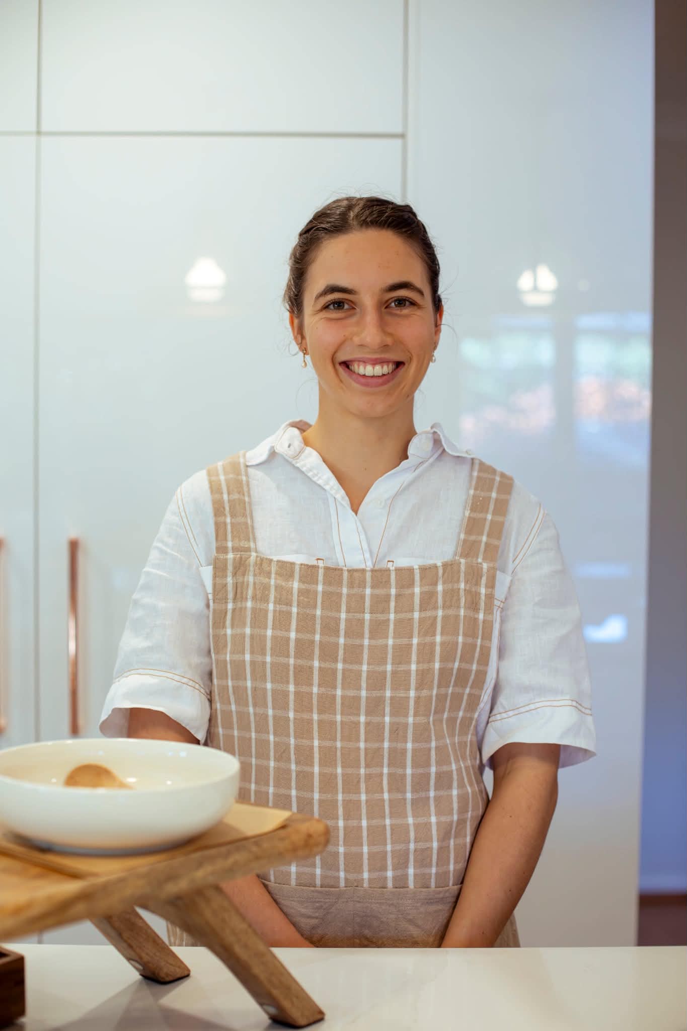 Victoria, founder of Come On Over, preparing for a private dining event