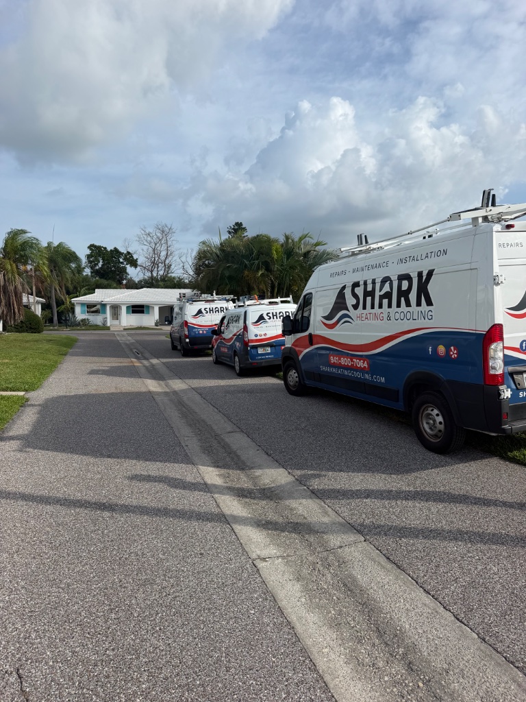 Shark Heating & Cooling service vans