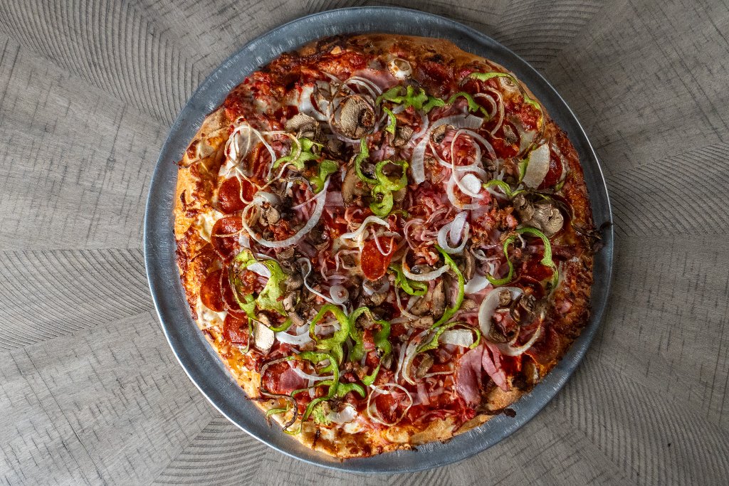 Piping hot specialty pizza from Ponderosa Pizza