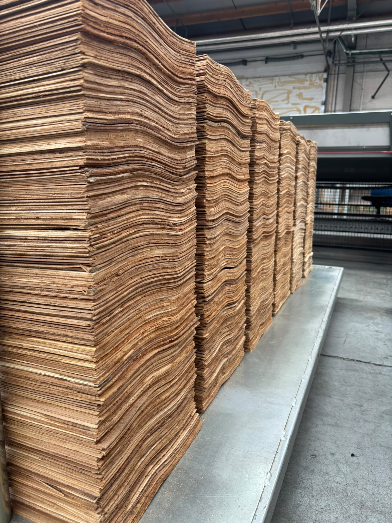 Stack of raw teak veneer sheets