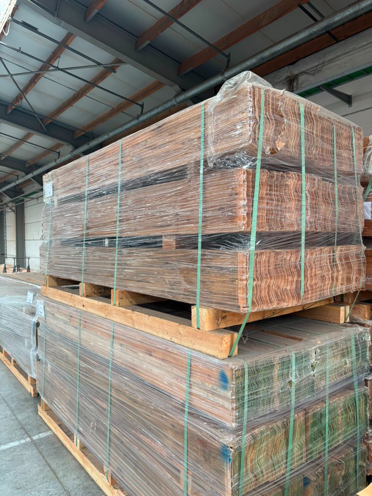Finished Maritime Teak blocks stacked and wrapped in the warehouse