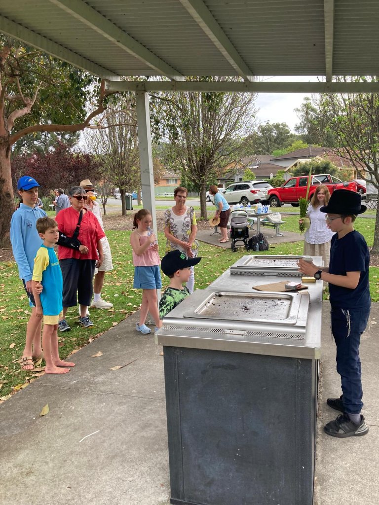 Sukkos in the Park — children and families enjoying the gathering