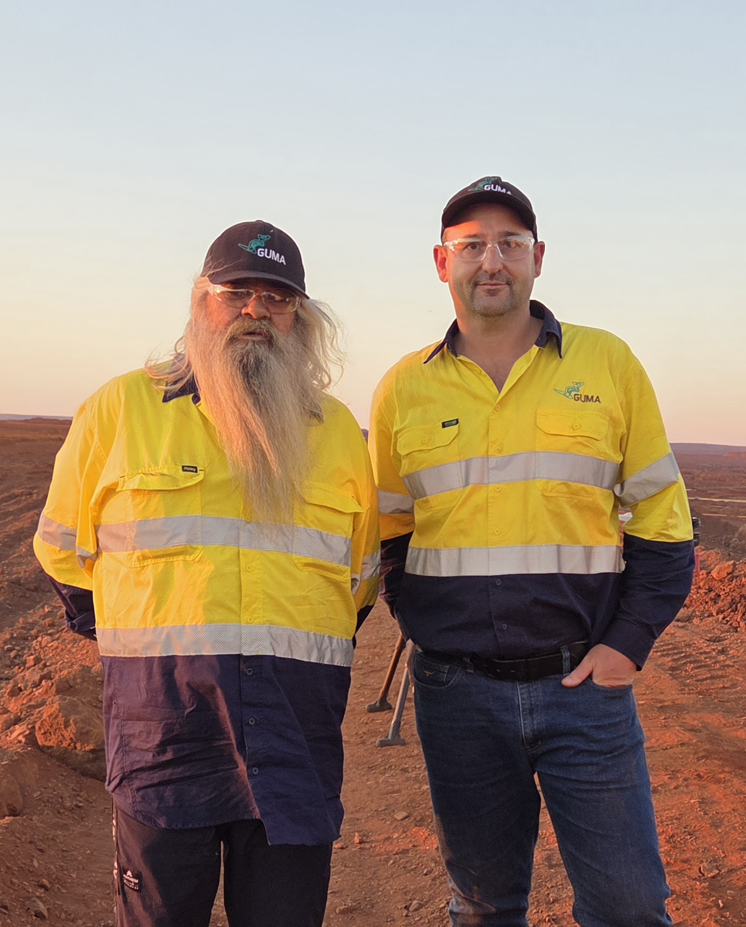 Raymond Drage and Mathew Cook on site at sunset