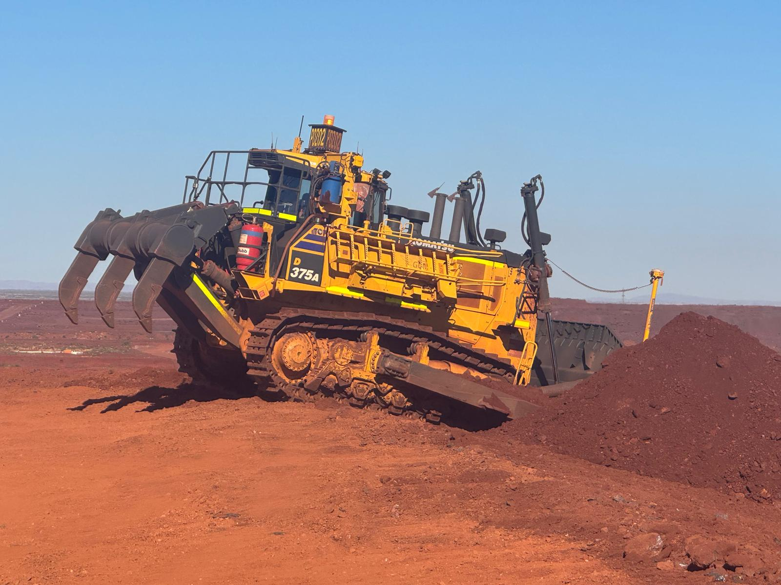 Komatsu D375A bulldozer PO202 ripping red earth on an iron ore site