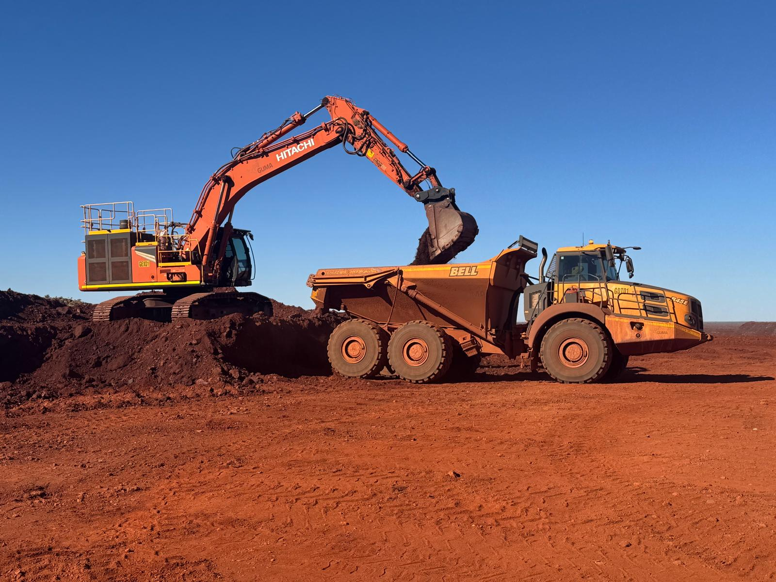 Hitachi Zaxis 490 excavator loading a Bell B45E dump truck