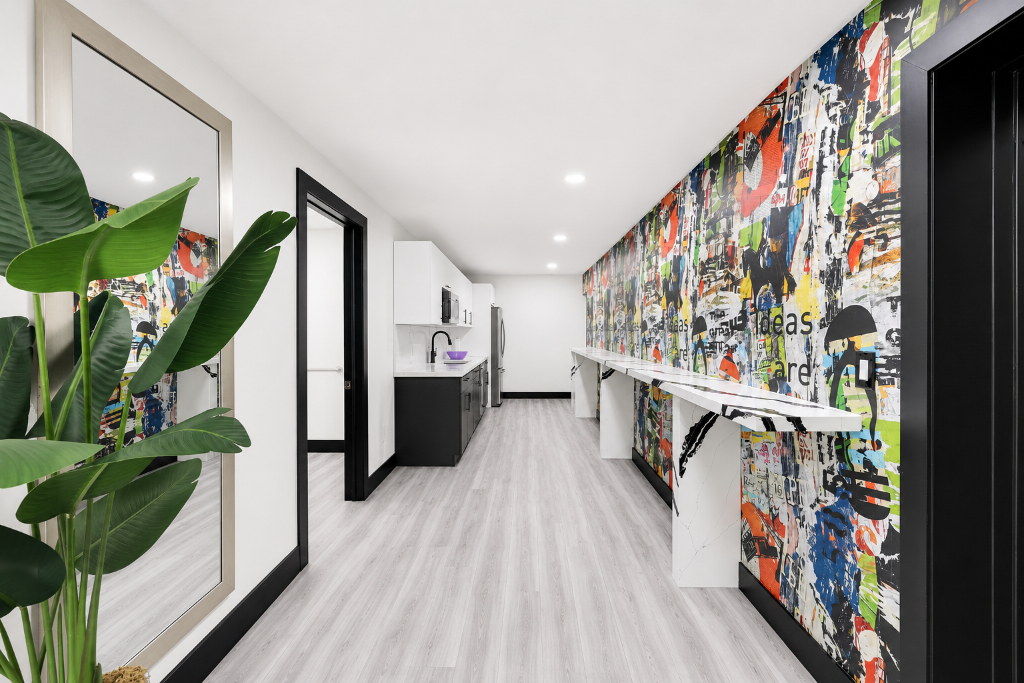 Hallway with art mural and marble console