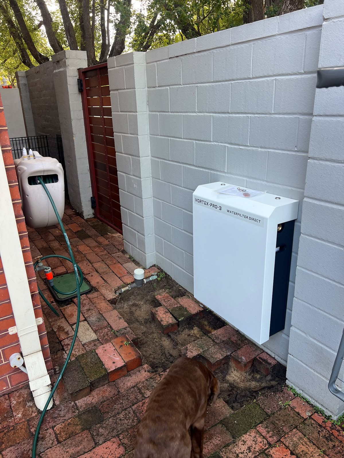 Vortex Pro water filtration system installed on a wall by Checkmate Plumbing